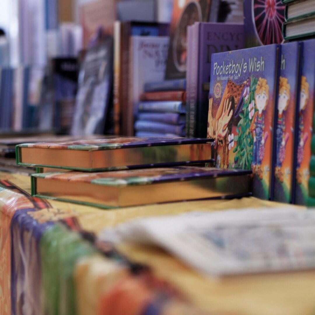 A table with many books on it